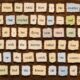 Collage of Scrabble-like tiles arranged to form a long narrative about a girl who could fly when the wind blew, on a brown wooden background.